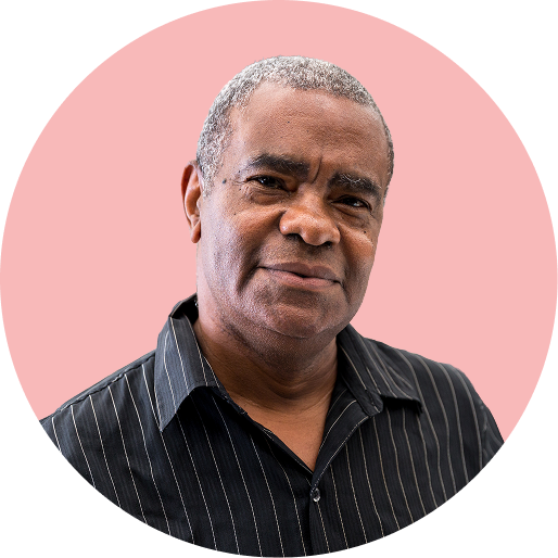 Black man in front of a red background