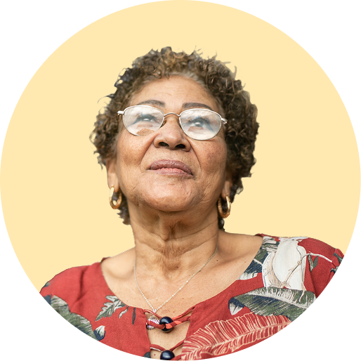 Older Hispanic woman featured in front of a yellow background